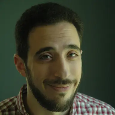 Professional headshot of Benjamin Feuer, Lead Organizer of the DCVLR competition from New York University (NYU).